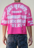 Men's pink cropped terry tee with studded rubber graphic