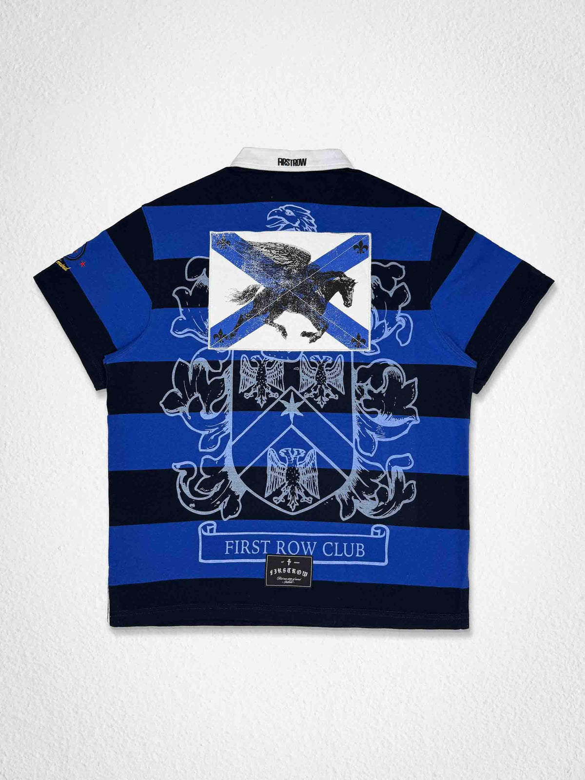 Men's royal blue washed polo with leather appliqué eagle crest patch