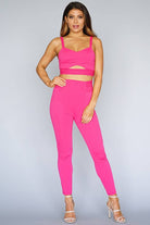 Women's fuchsia buckle strap cutout top and high-waist leggings two-piece set