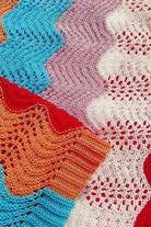 Women's red crochet knit mini dress on model