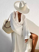 Women's deep V-neck flared sleeve midi dress in white or black – front view