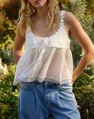 Women's white lace v-neck sleeveless crop top with tie front and ruffles