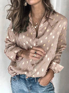 Women's metallic foil button-up lapel shirt in silver or champagne – front view