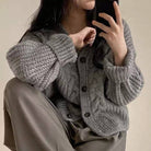 Women's oversized V-neck jacquard knit cardigan sweater in pink, gray or cream – detail view