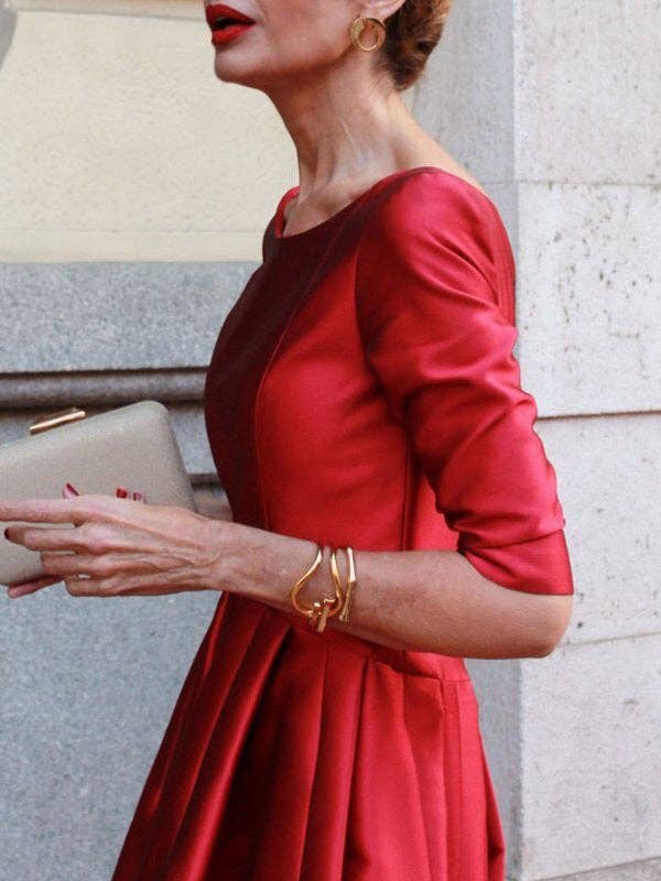Women's pleated A-line round neck midi dress with pockets in red, green or black – styled view