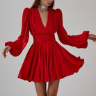 Women's red satin long puff sleeve mini dress with pleated skirt and fitted waistband