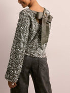 Women's grey sequin long sleeve top with cutout back and ribbon tie