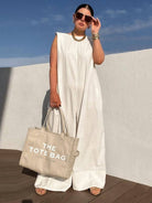 Women's sleeveless cotton wide-leg jumpsuit in black, white, gray, green or yellow – detail view