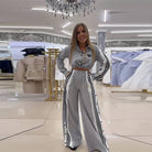Women's black striped lapel crop shirt and high-waist wide-leg pant set – front view